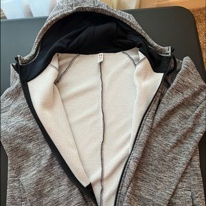 Grey and white Under Armour Hooded jacket.
